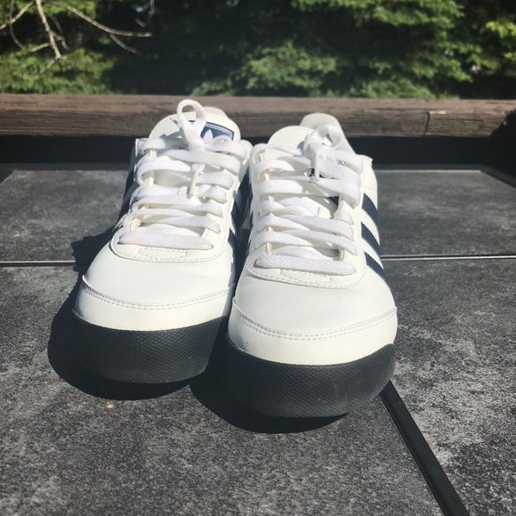 navy blue and white tennis shoes